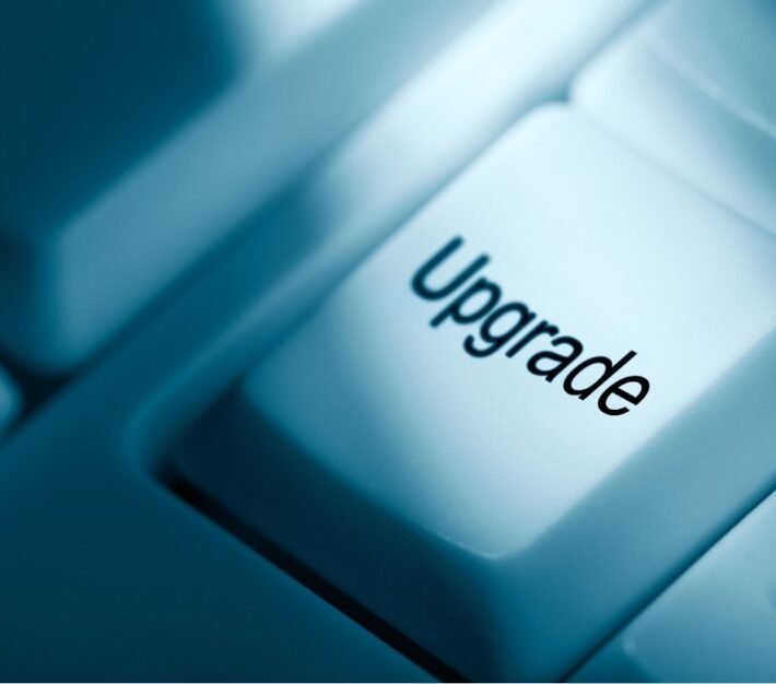 Close-up of a keyboard key labelled upgrade, illustrating business upgrades for profitable growth