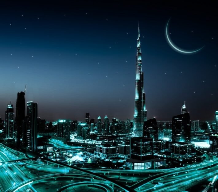 Dubai skyline at night with the Burj Khalifa and a crescent moon, illustrating Ramadan business opportunities